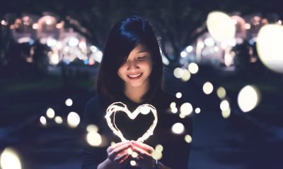 A woman holding a heart